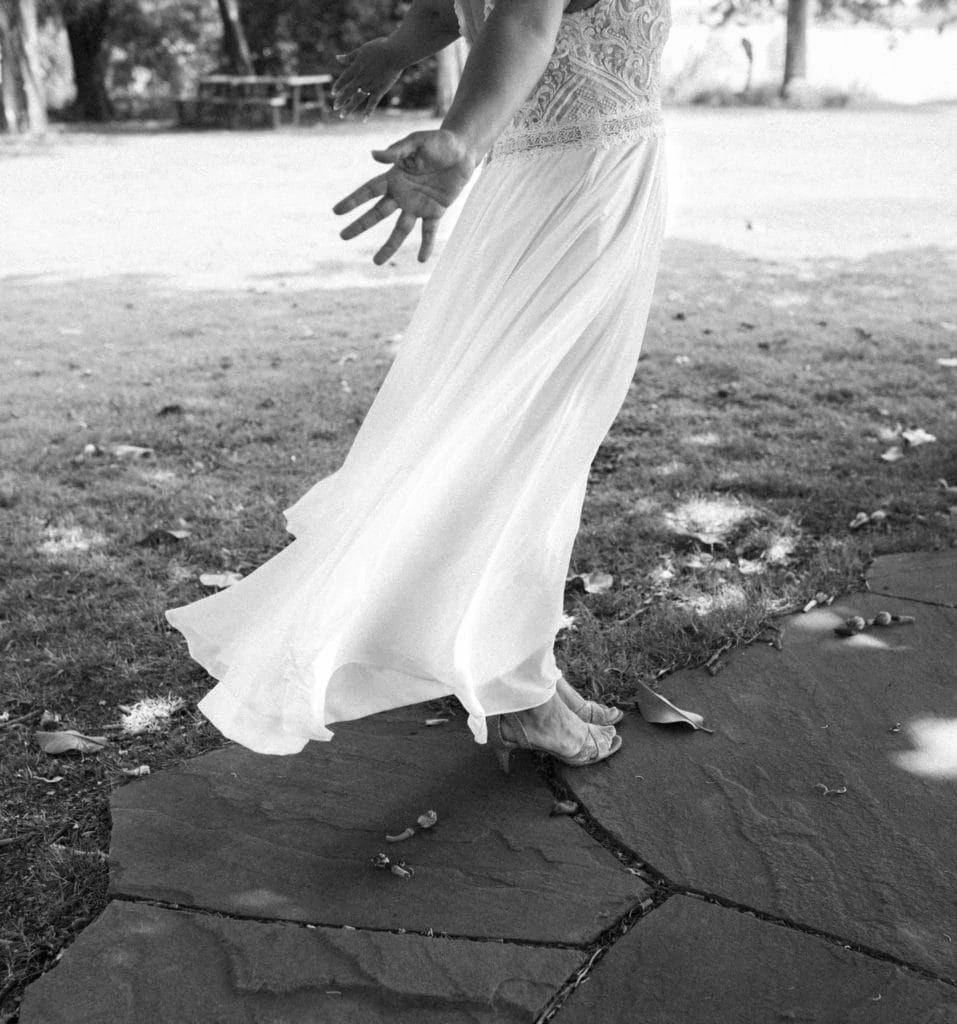 wind rushes through the a bride's skirt