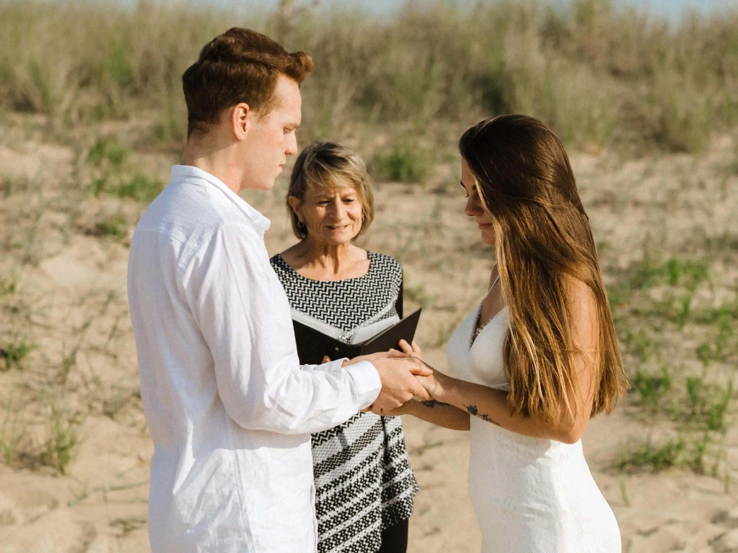 officiant at first landing state park overseas a beach wedding for a couple